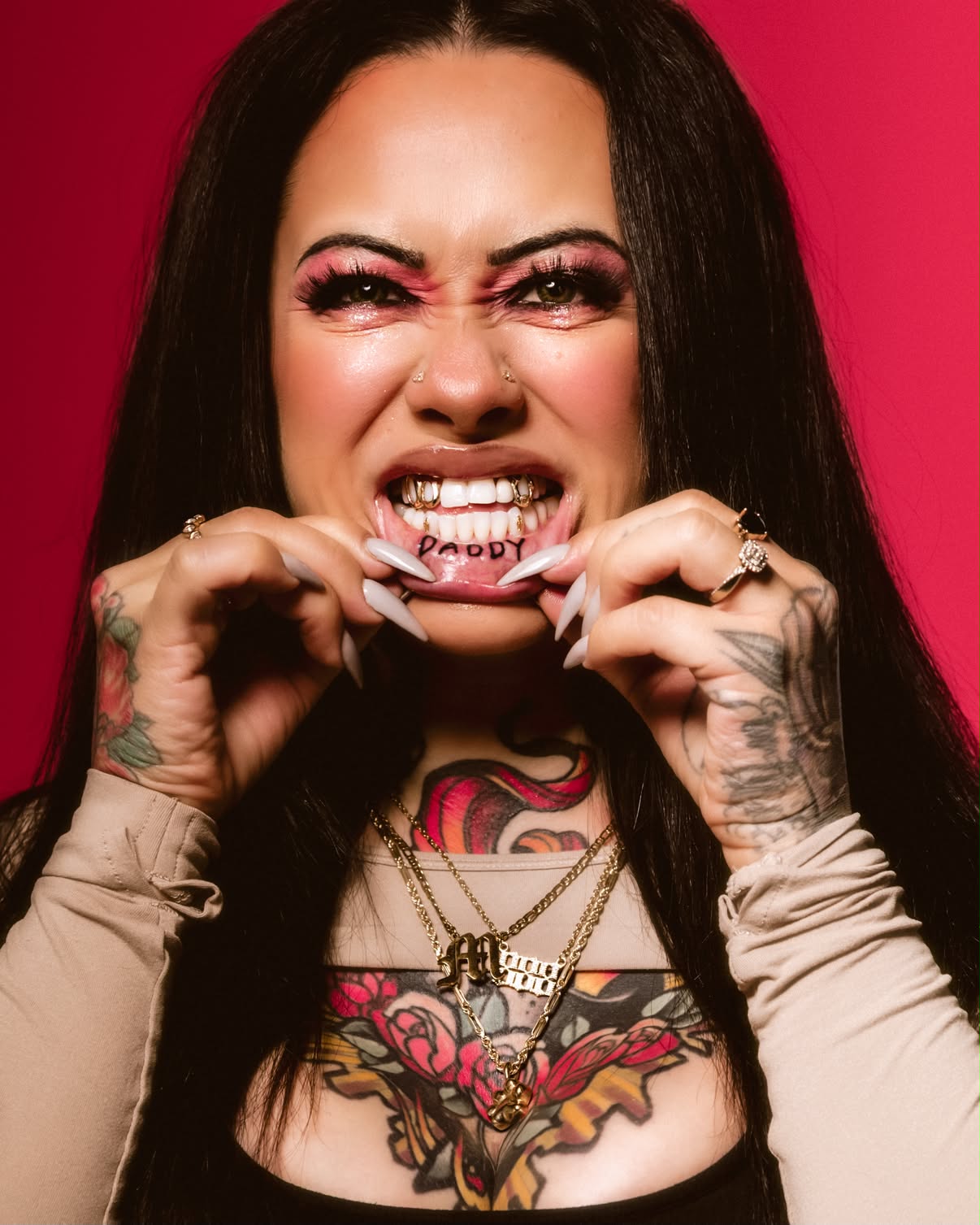 Client smiling with grillz and tooth gems