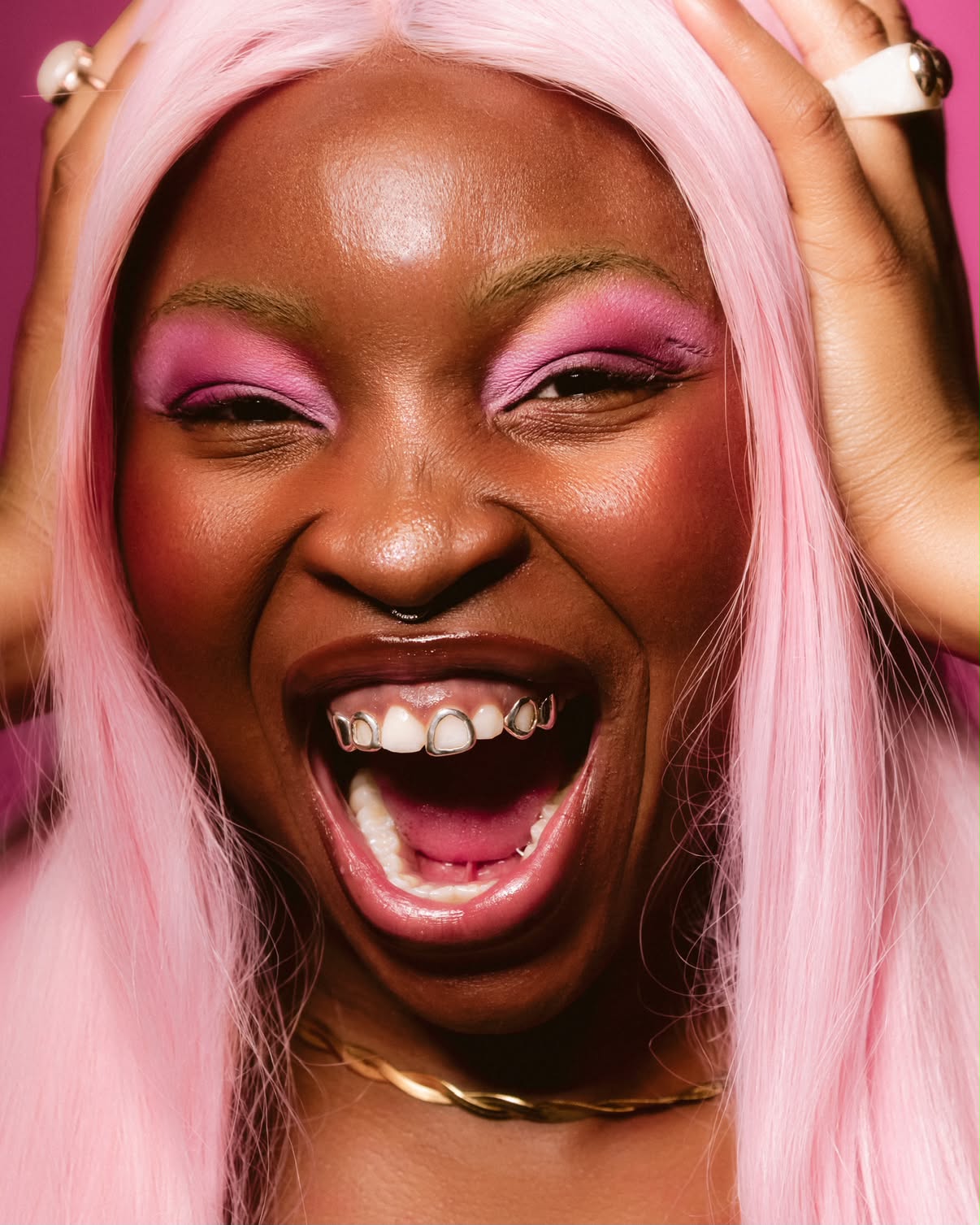 Client laughing with Glitz and Grillz smile jewelry