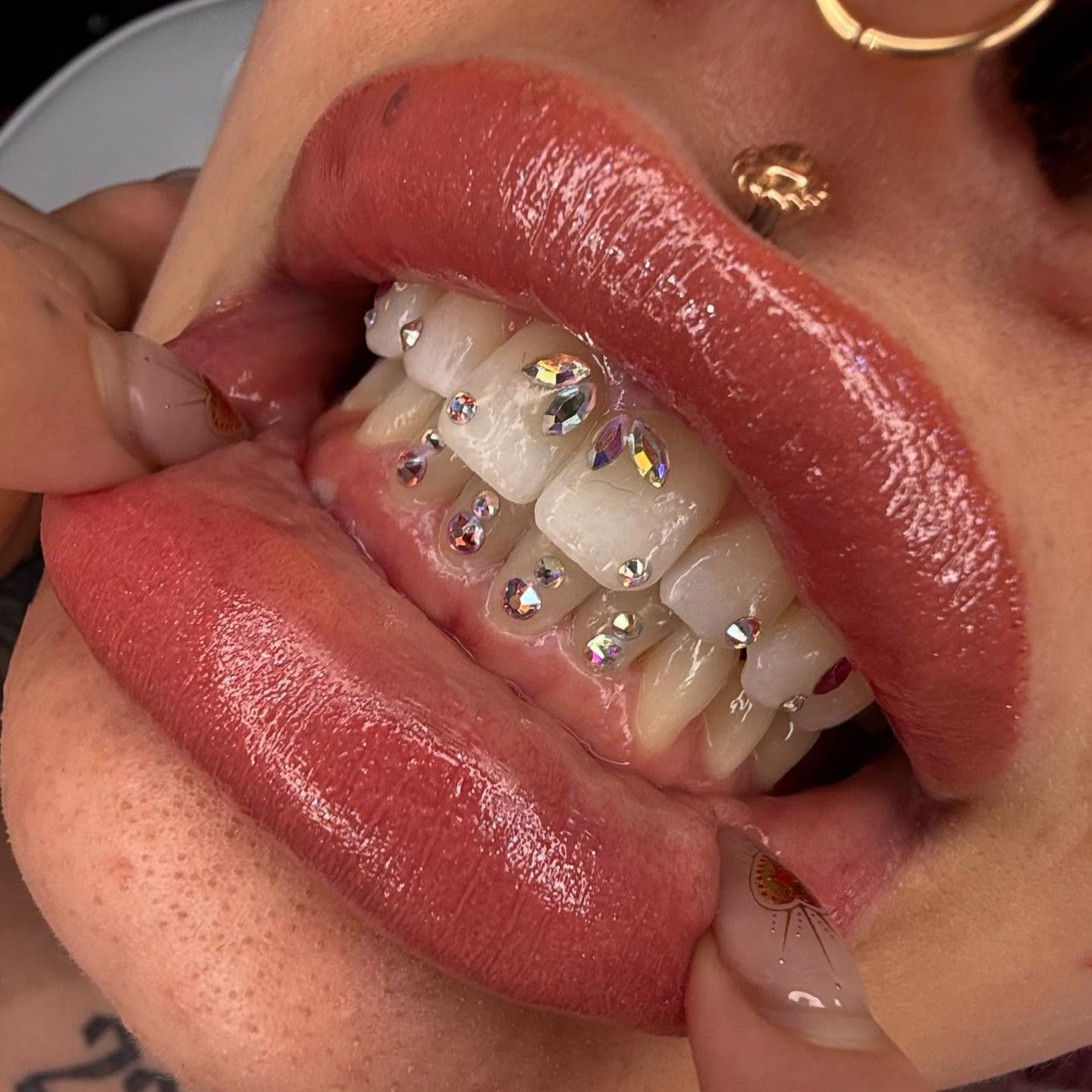 Close-up of gold tooth jewelry